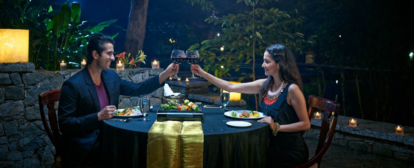 A romantic candle light dinner by the pool side at Club Mahindra Resorts